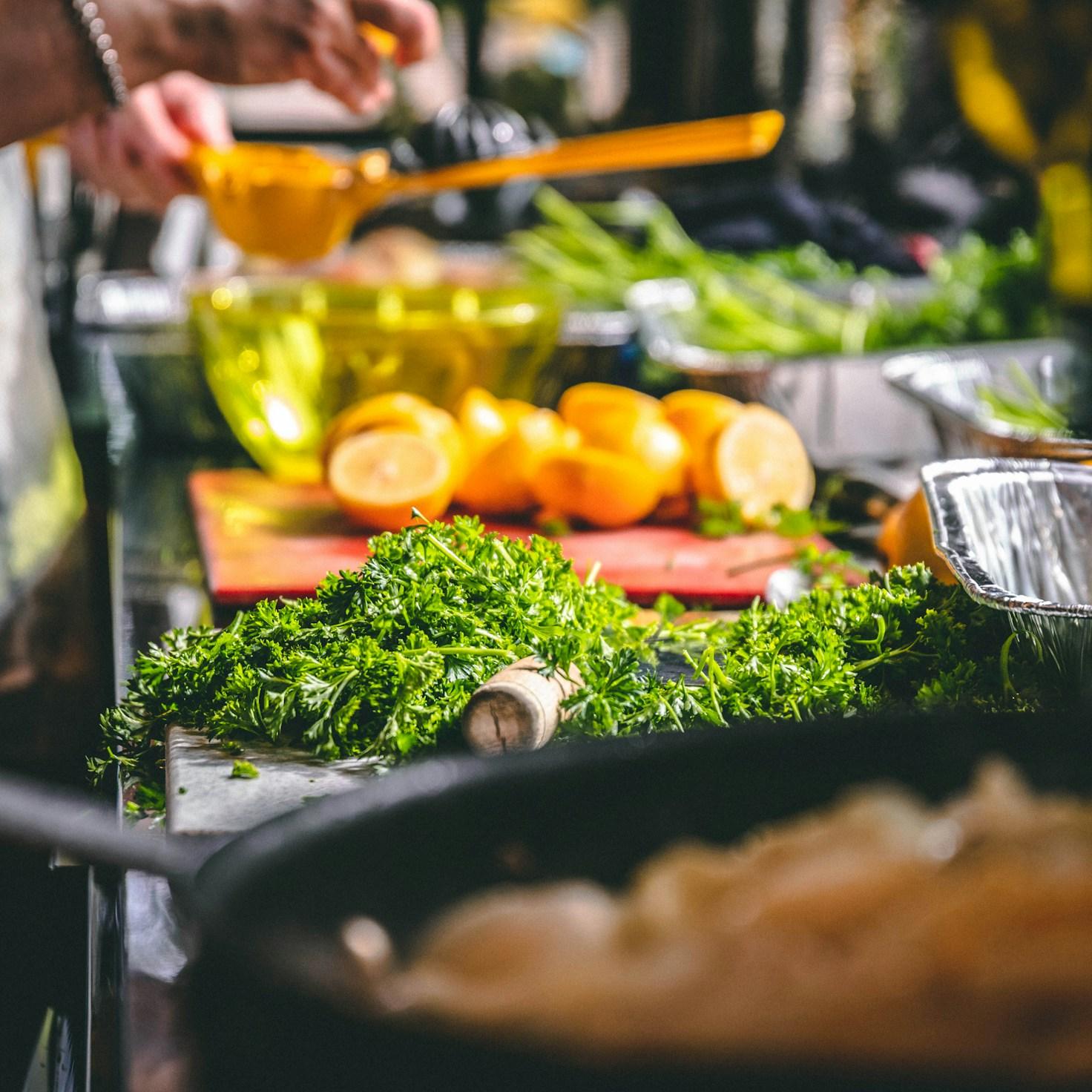 Community members collaborating in a modern kitchen space, sharing recipes and cooking techniques